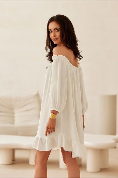 The Giulia Dress by Roco Fashion elegantly draped on a model, showcasing its flowy design and ruffle details for effortless summer charm.