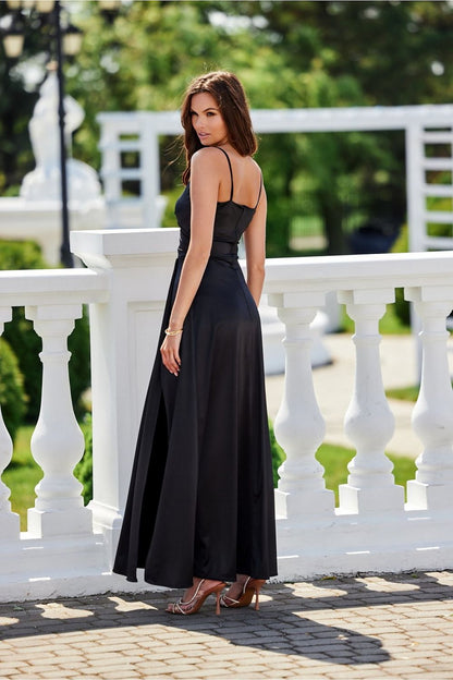 Model wearing the elegant long Salma dress by Roco Fashion, elegantly posing to showcase the sexy slit detail.