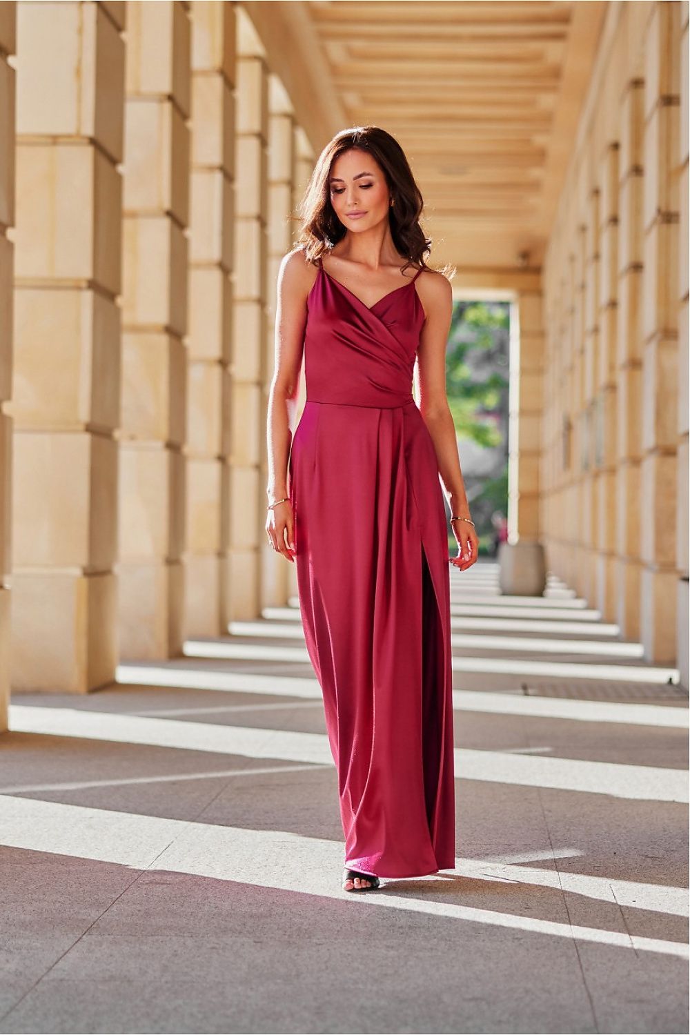 Elegant satin long Salma dress with slit by Roco Fashion in soft satin, showcasing a gathered wrap neckline and thin straps perfect for any elegant occasion.
