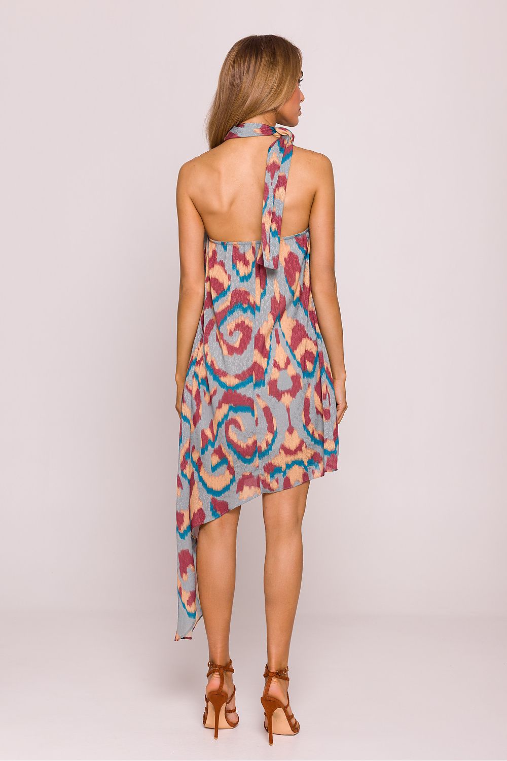 Elegant sleeveless Moe Daydress showcasing a unique halter neck design and open back, ideal for warm weather elegance.