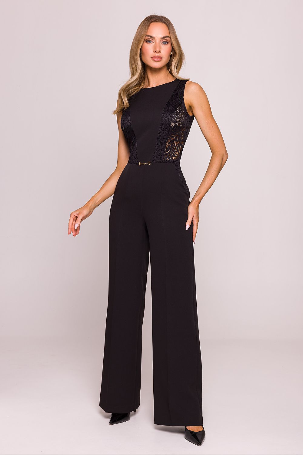 Flat lay of the Moe elegant geometric lace jumpsuit, showcasing the fine fabric texture and intricate lace detailing that enhances its refined appeal.