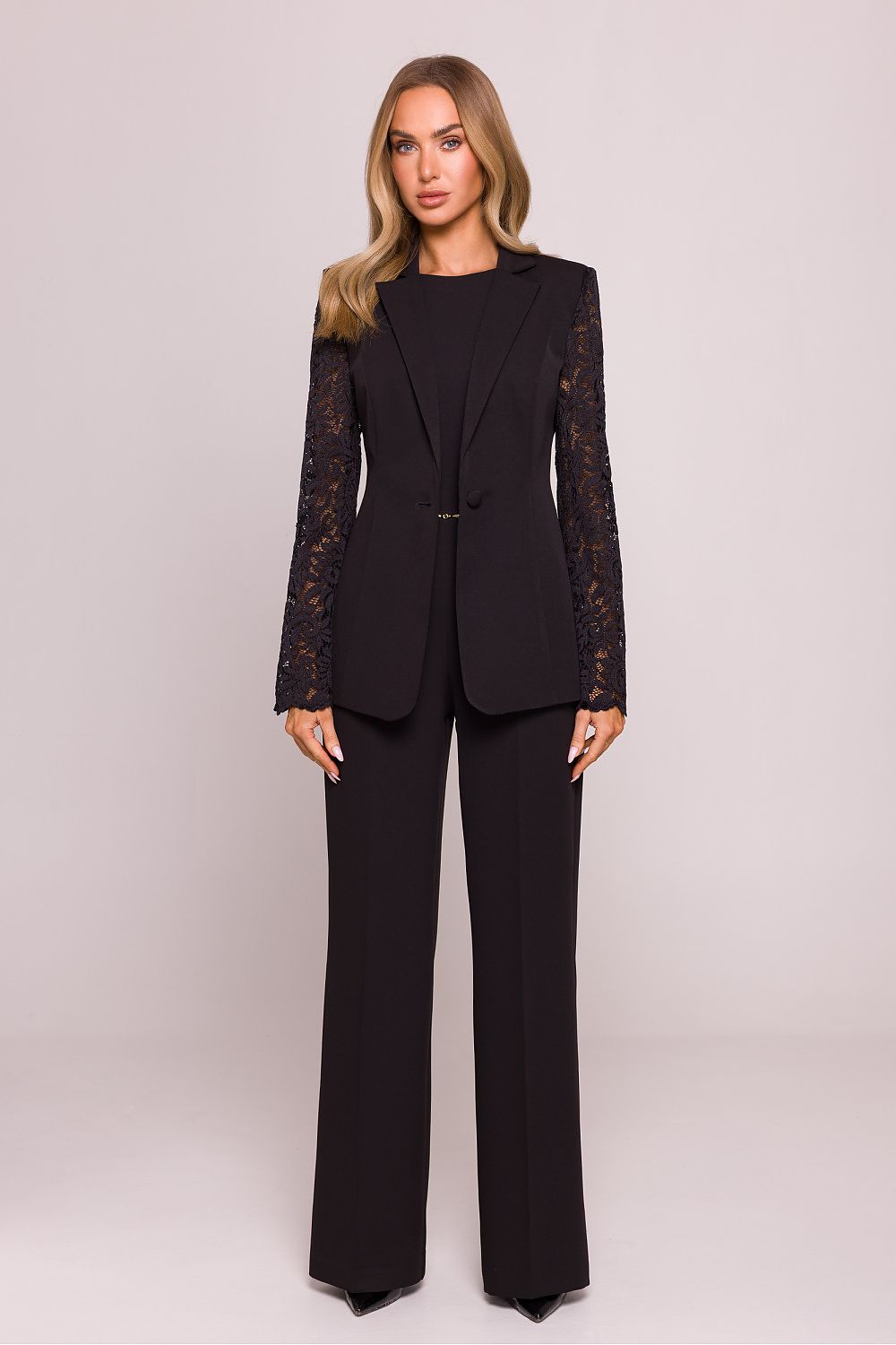 Elegant Lace Sleeve Blazer Jacket by Moe, displayed with a model showcasing its hip-length design and seamless blend of elegance and contemporary style.