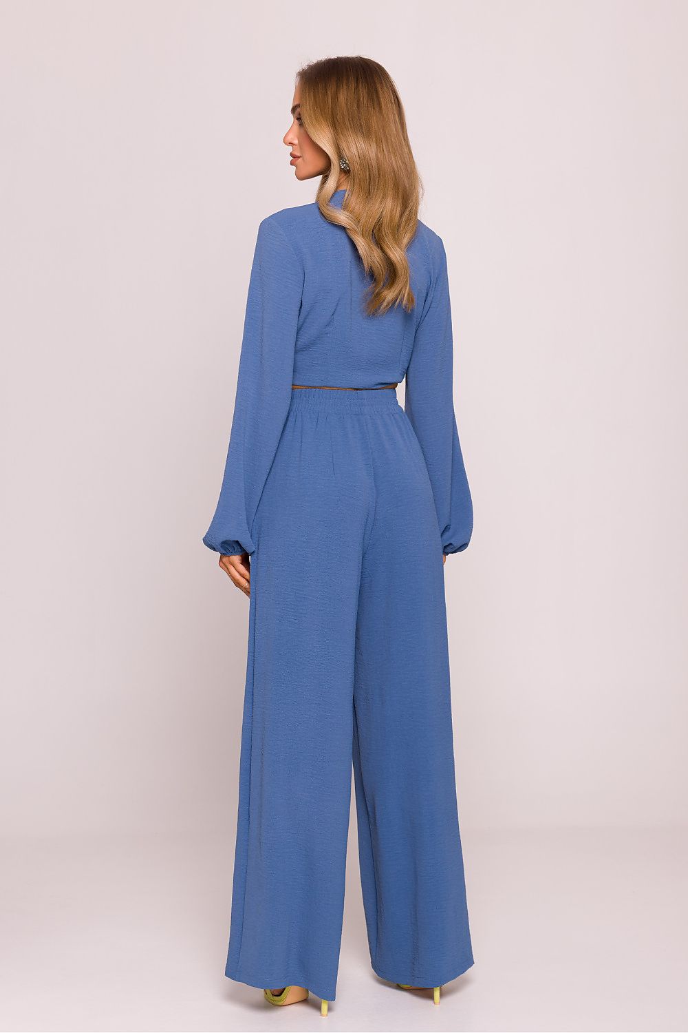 Close-up of Moe Women's Lightweight Crepe Trousers, highlighting the refined crepe fabric and stylish silhouette perfect for sophisticated styling.