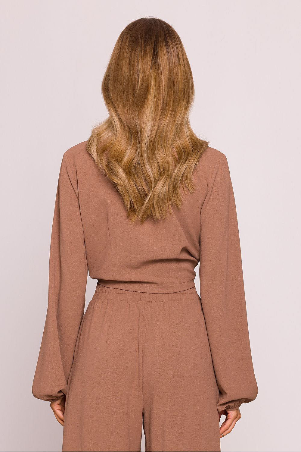 Luxury Crepe Crop Blouse by Moe featuring a deep V-neckline and puffy sleeves, elegantly styled for a chic silhouette.