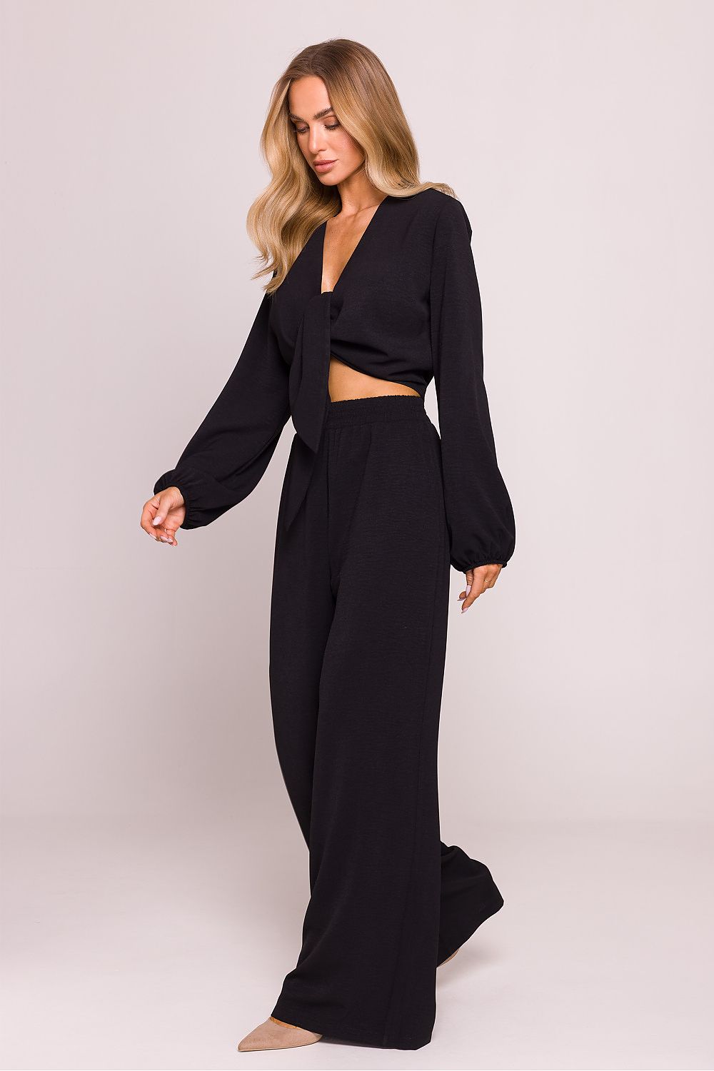 Model wearing Moe's Luxury Crepe Crop Blouse paired with high-waisted trousers, highlighting the perfect fit for stylish layering.