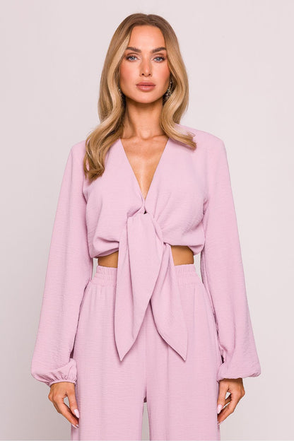 Flat lay of Moe's Luxury Crepe Crop Blouse on a soft surface, displaying its lightweight crepe fabric and elegant design.