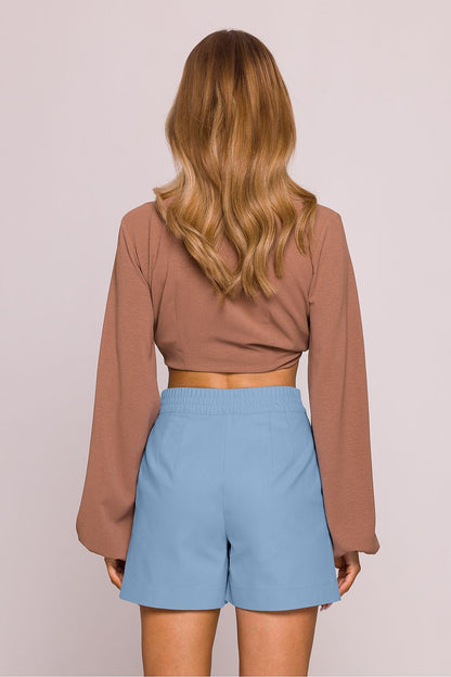 Moe's high-waisted cotton shorts styled with an elastic back waistband and elegant design elements, providing both comfort and refined aesthetics.