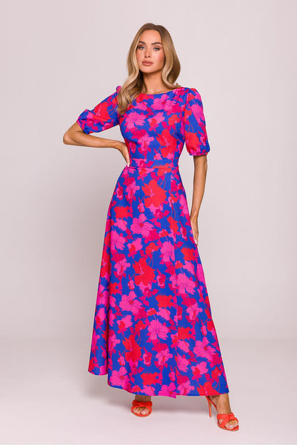 Elegant floral print daydress featuring a high slit and cutout back by Moe, showcasing its romantic charm and sophisticated design.