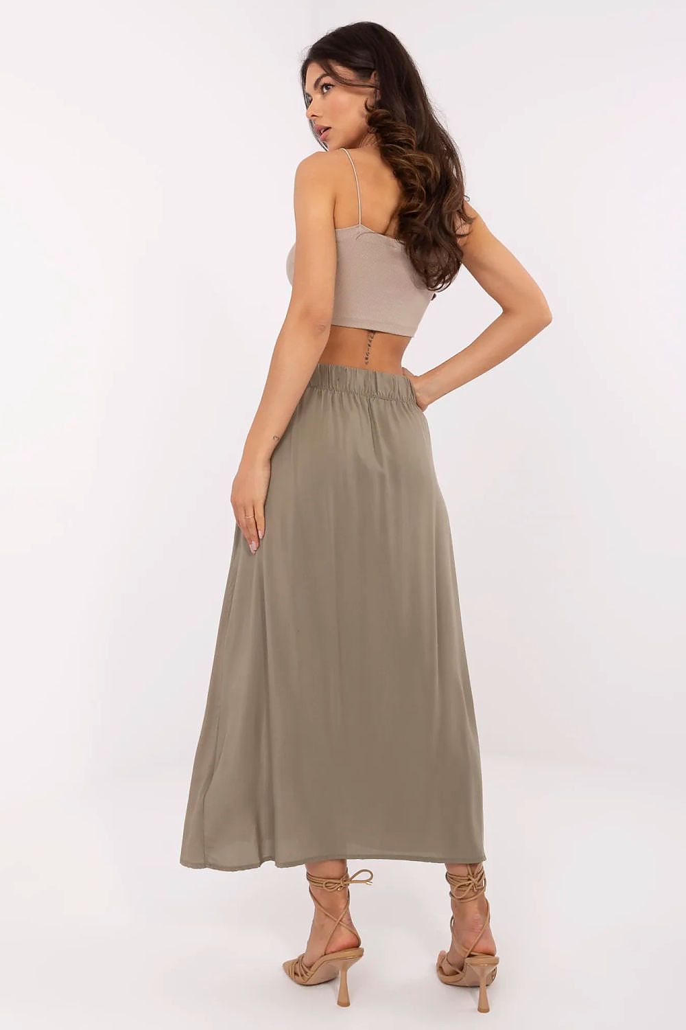 Elegant eco-friendly midi skirt by Fresh Made, crafted from 100% viscose fabric, showcasing a sleek design with stylish slip pockets.
