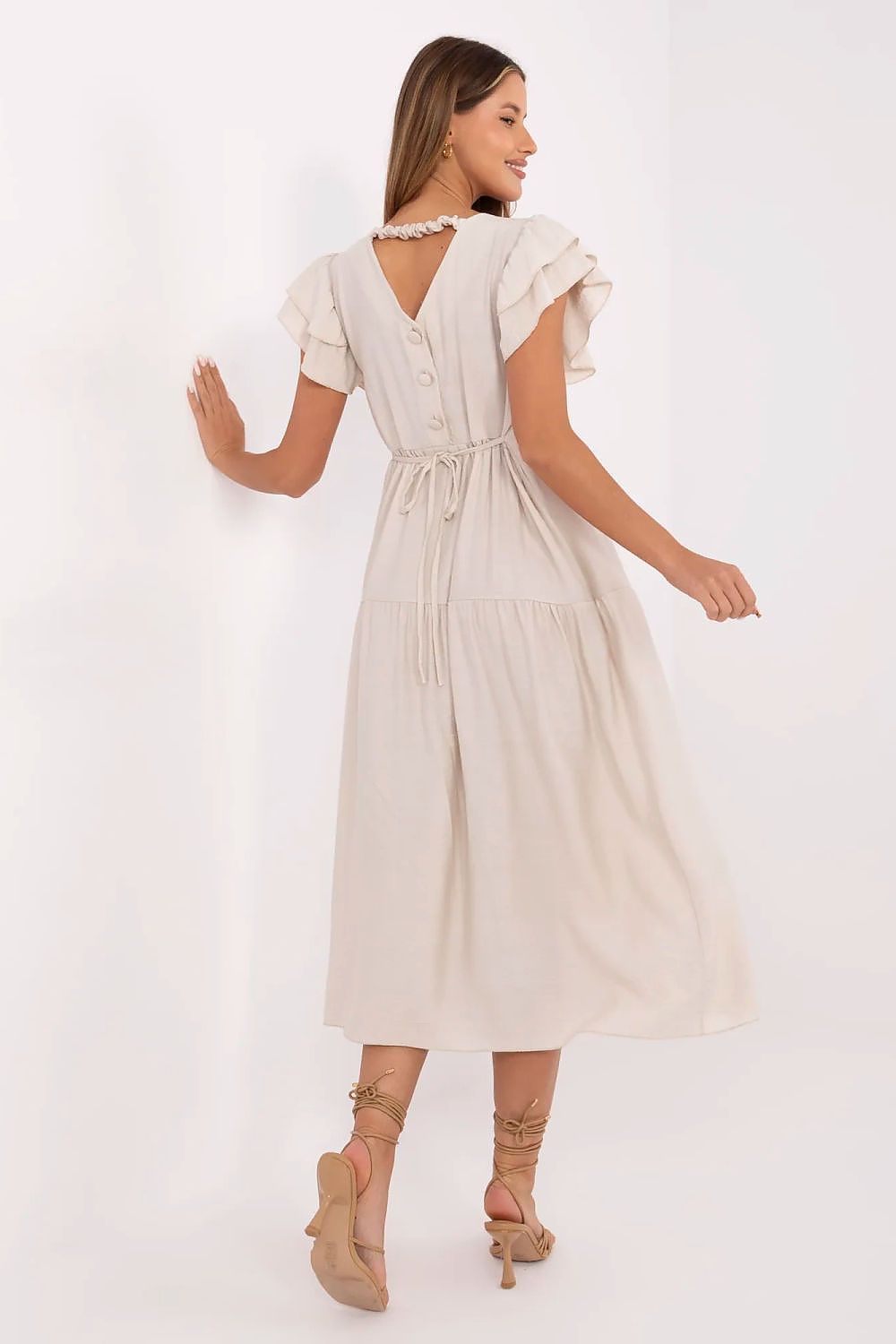 Lifestyle shot of the Elegant Midi Daydress by Italy Moda, styled for everyday wear, displaying its versatility and the luxurious blend of viscose and nylon.
