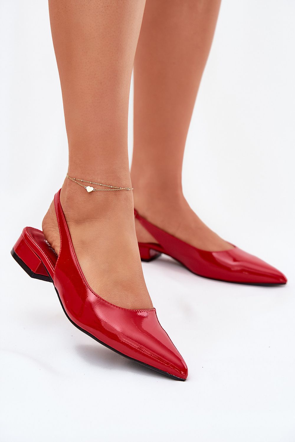Elegant patent leather ballet flats by Step in Style featuring low block heels, perfect for adding sophistication to any outfit.