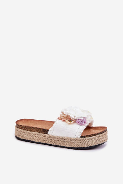 Step in Style's exquisite women's flip-flops showcasing a floral pattern with teddy bear embellishment, designed for comfort and chic summer outings.