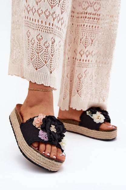 Charming women's flip-flops from Step in Style, featuring a comfortable eco-suede insole, jute braided platform, and delightful floral and teddy bear accents.