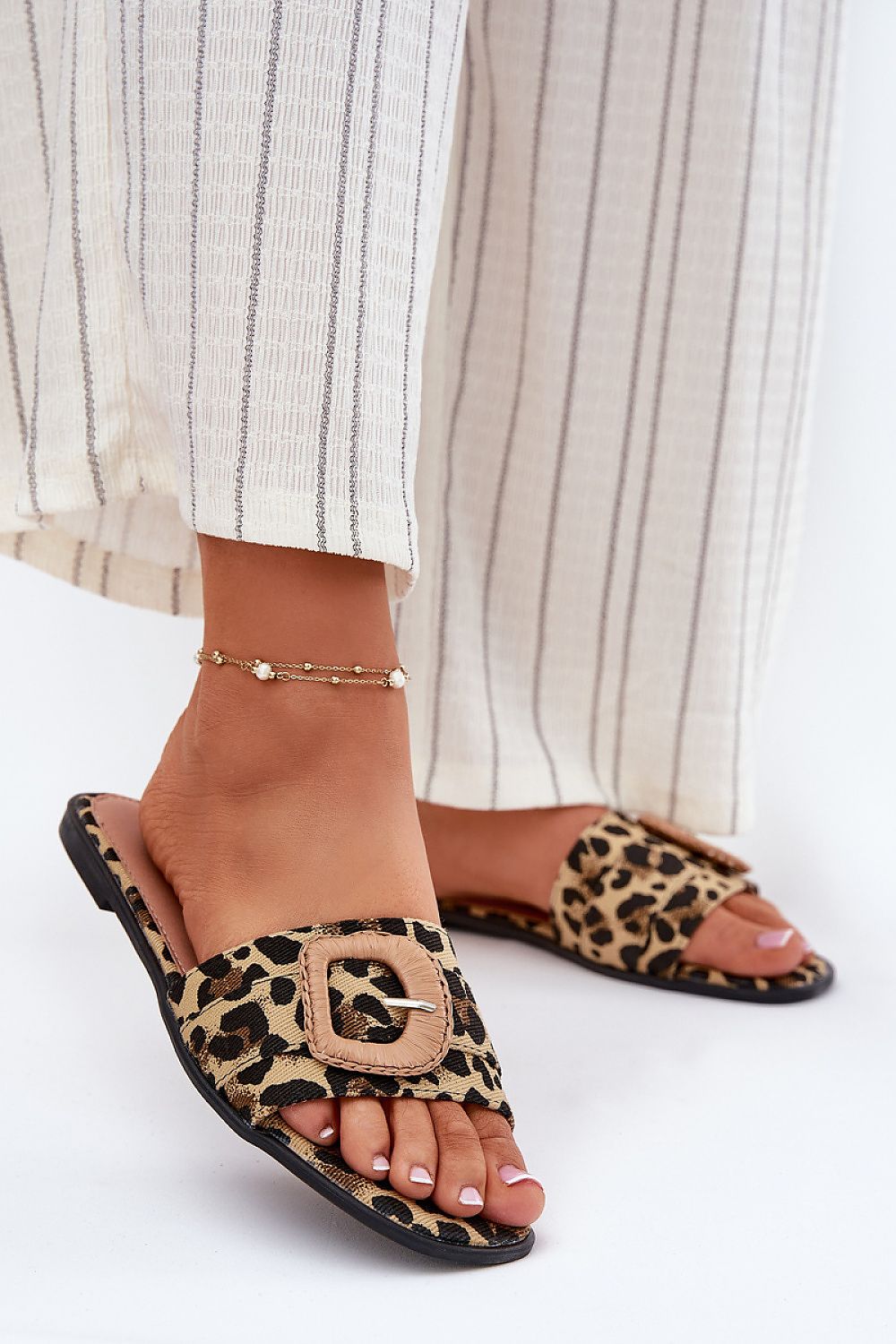 Chic women's flat sandals in textile material with a decorative buckle, crafted by Step in Style for trendy everyday fashion.