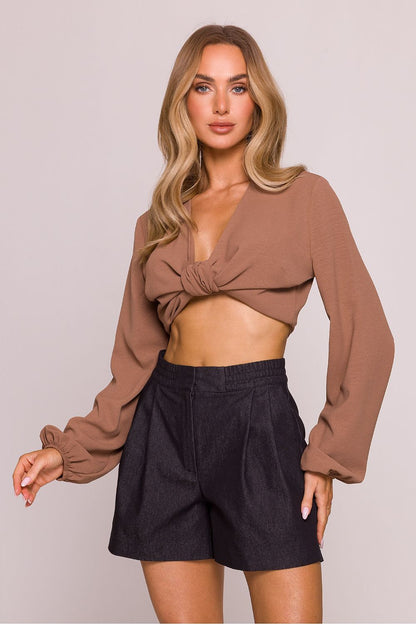 Stylish model wearing high-waisted cotton shorts by Moe, perfect for summer with a light and flared leg design.