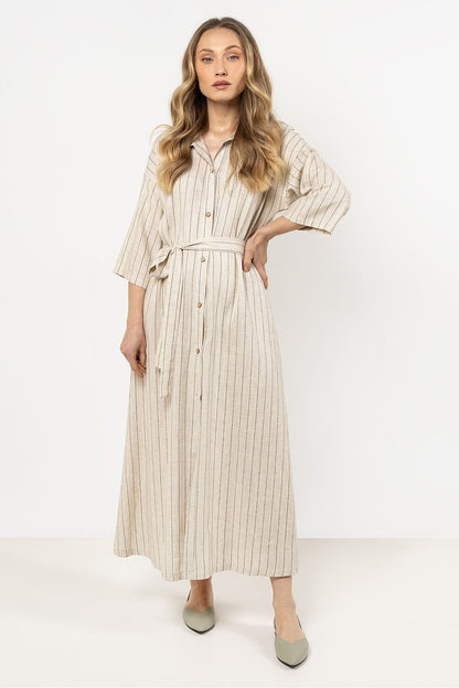 Awama's elegant linen shirtdress in a flattering trapeze cut, perfect for both casual and formal occasions, designed with chic button closure.