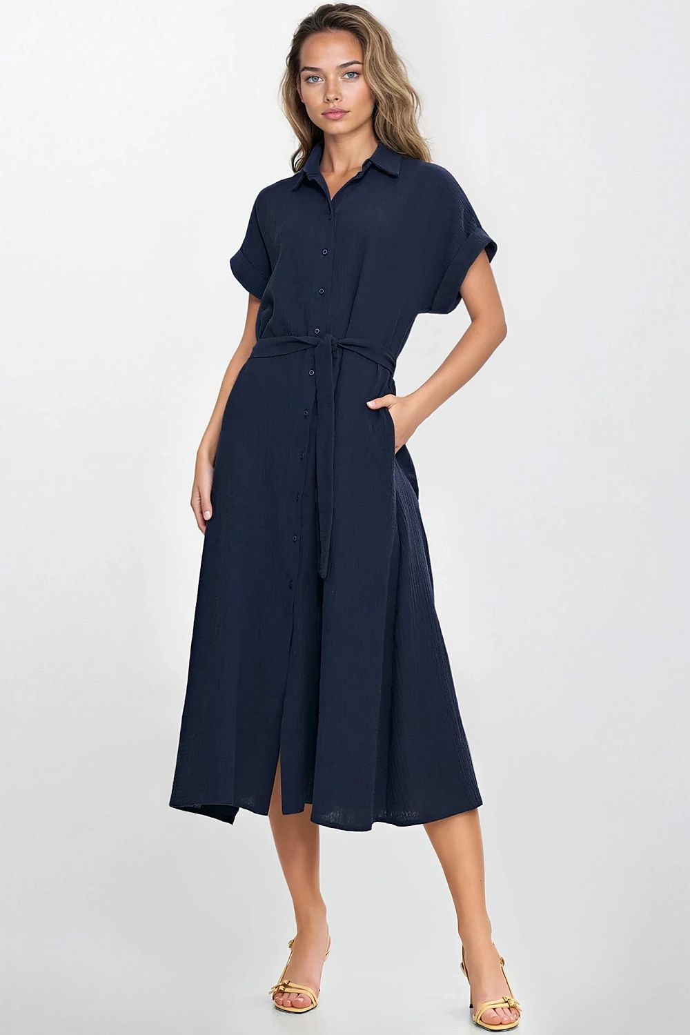 Close-up view of the Nife Relaxed Fit Daydress, highlighting its delicate pleats and feminine round neckline, embodying comfort and style.