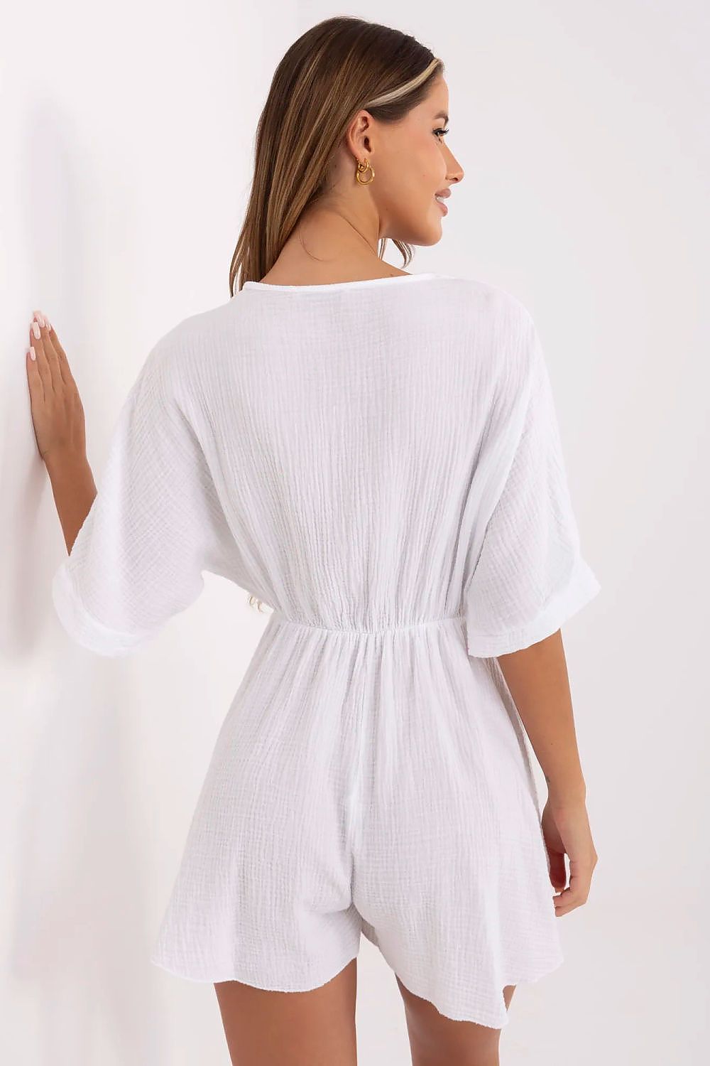 Stylish Italy Moda jumpsuit designed for comfort and elegance, showcasing a flattering silhouette with its wrap design and soft texture.