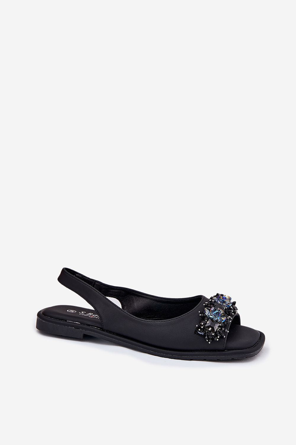 Close-up of Step in Style elegant eco leather sandals for women, showcasing exquisite crystal decoration on a chic flat heel design.