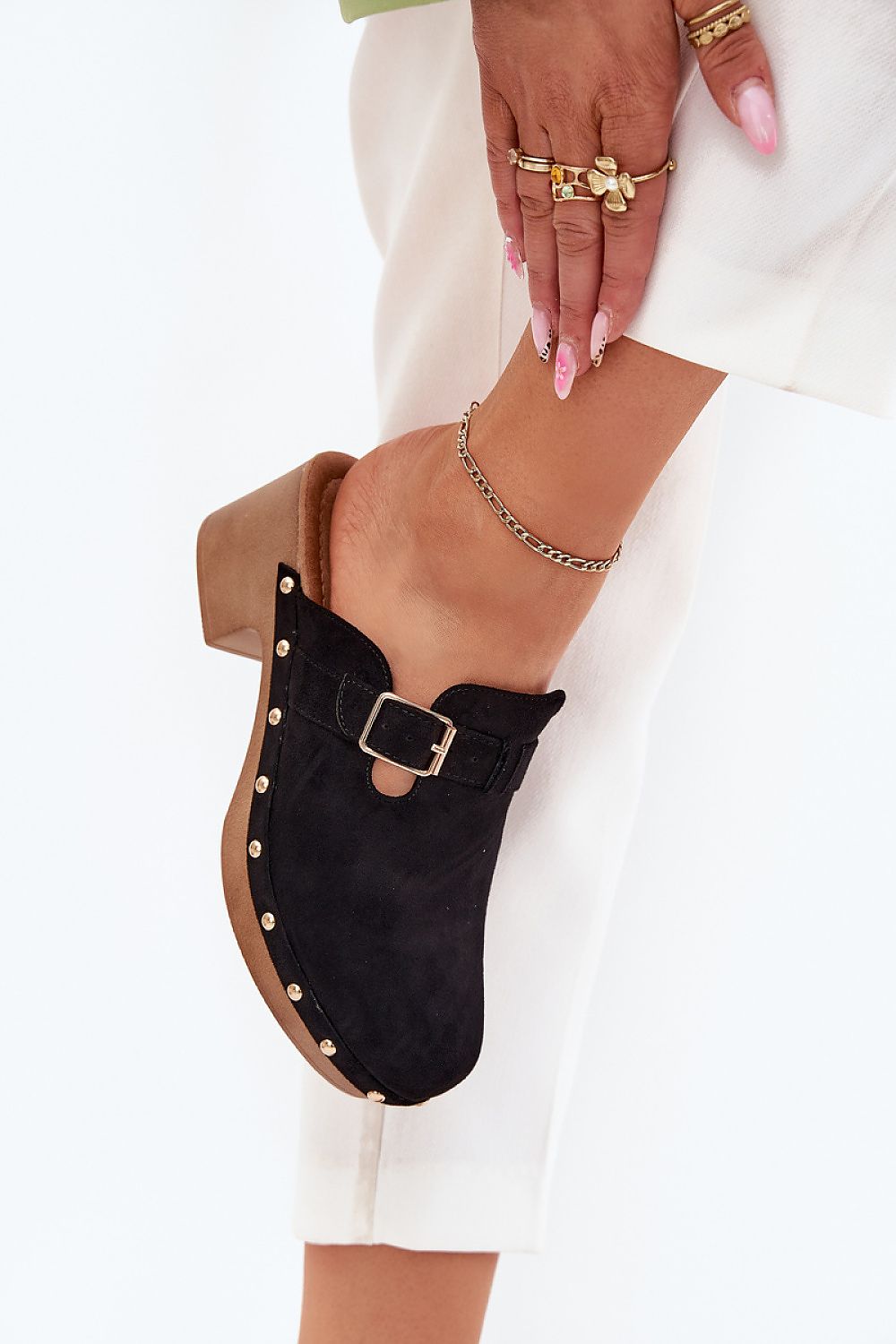 Chic women's clogs in eco suede by Step in Style, showcasing their rich texture, stylish gold buckle, and edgy studded design perfect for fashionable everyday wear.