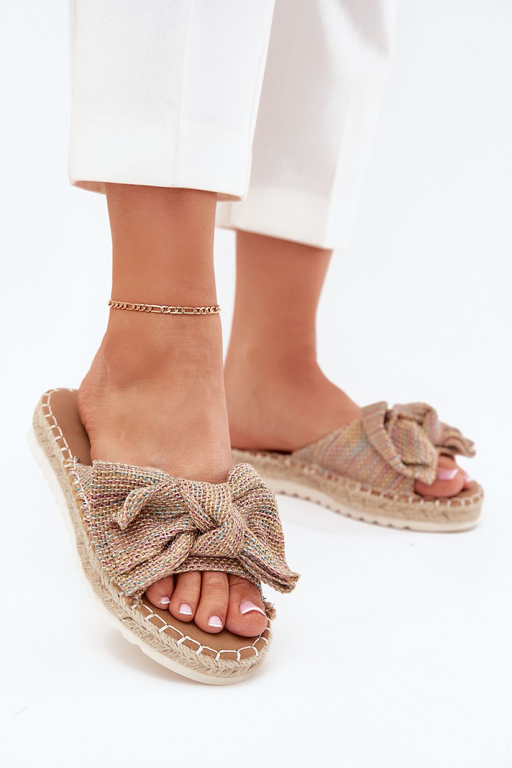 Stylish women's platform flip-flops by Step In Style displayed with fashionable outfits, perfect for dressing up casual looks with a touch of luxury.