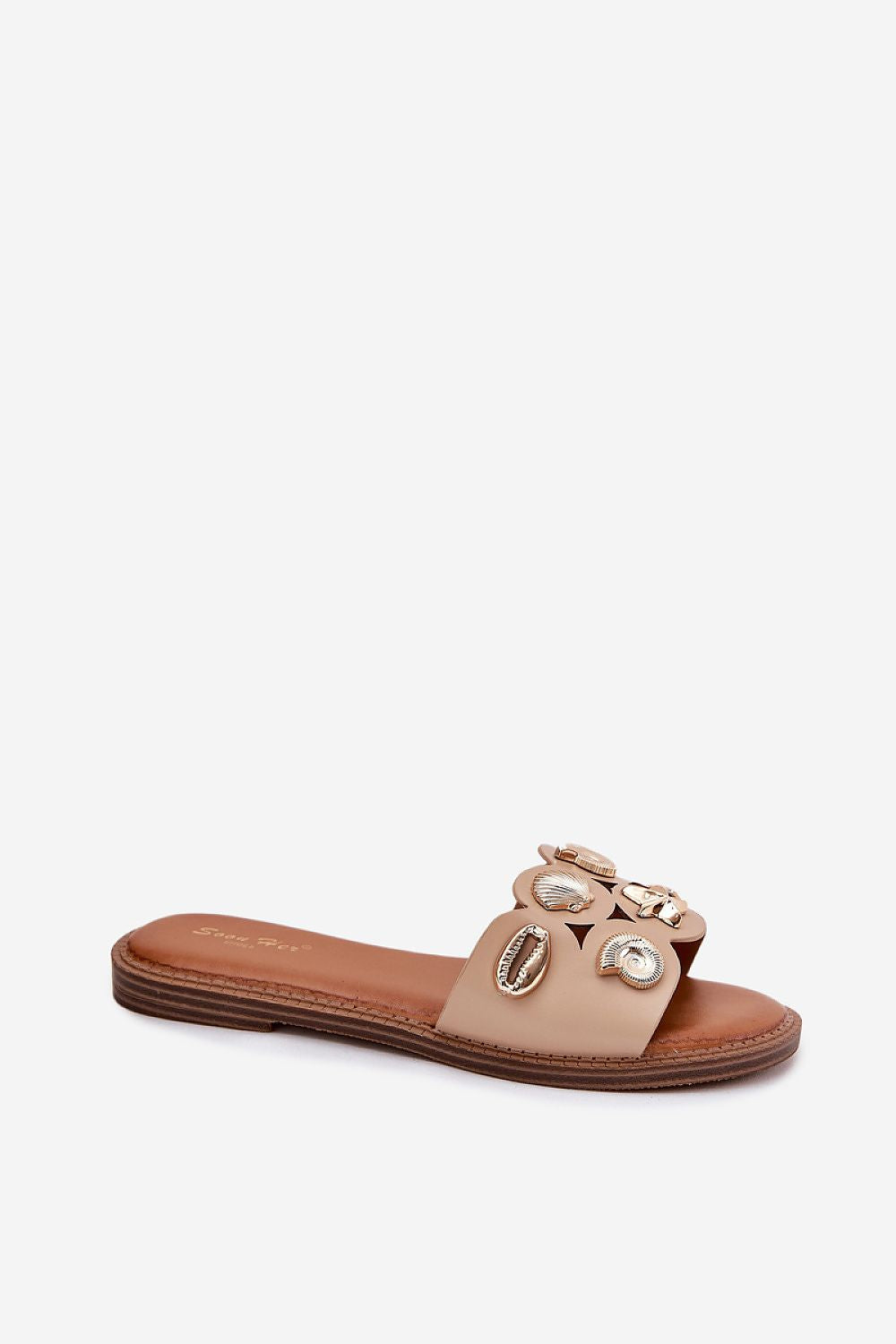 Close-up of Step in Style luxury eco leather women's sandals showcasing intricate gold marine pins and soft insole for all-day comfort.