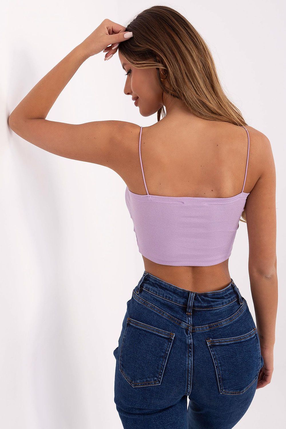 Stylish flat lay of the Sublevel ribbed cotton camisole top, highlighting its minimalist design suitable for warm weather.