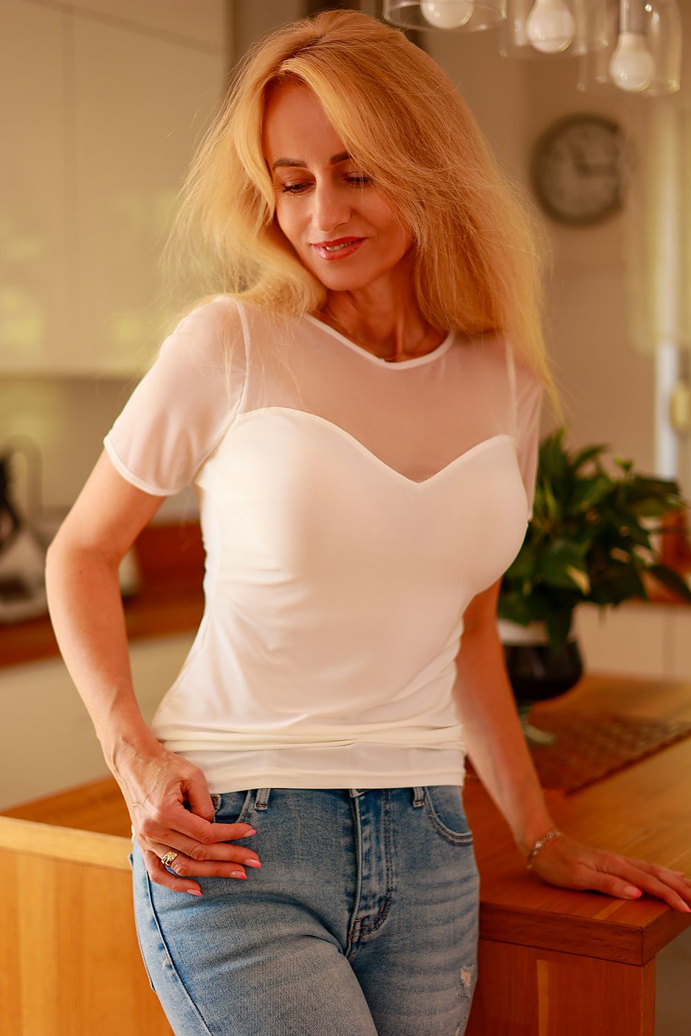 Luxurious Mirale Celia Blouse crafted from fitted microfiber and chiffon mesh, showcasing elegant casual styling perfect for versatile outfits. Available in sizes S to XXL.