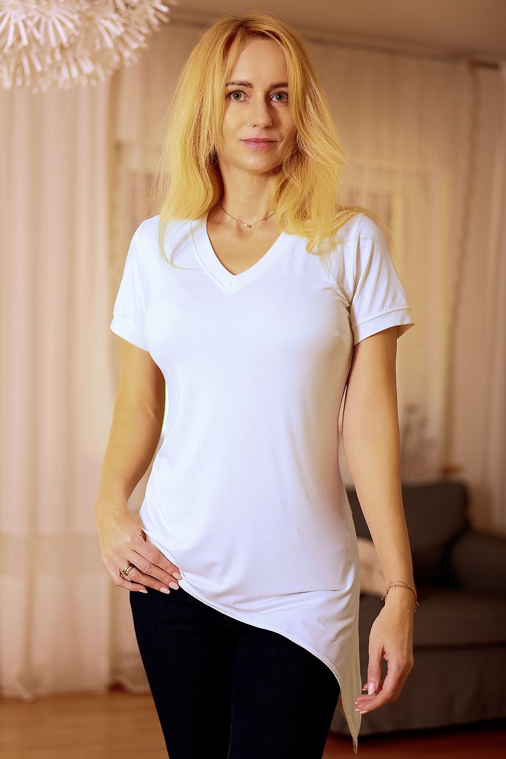 Elegant Mirale Classic V-Neck Blouse in breathable viscose with extended sides, perfect for spring-summer fashion.