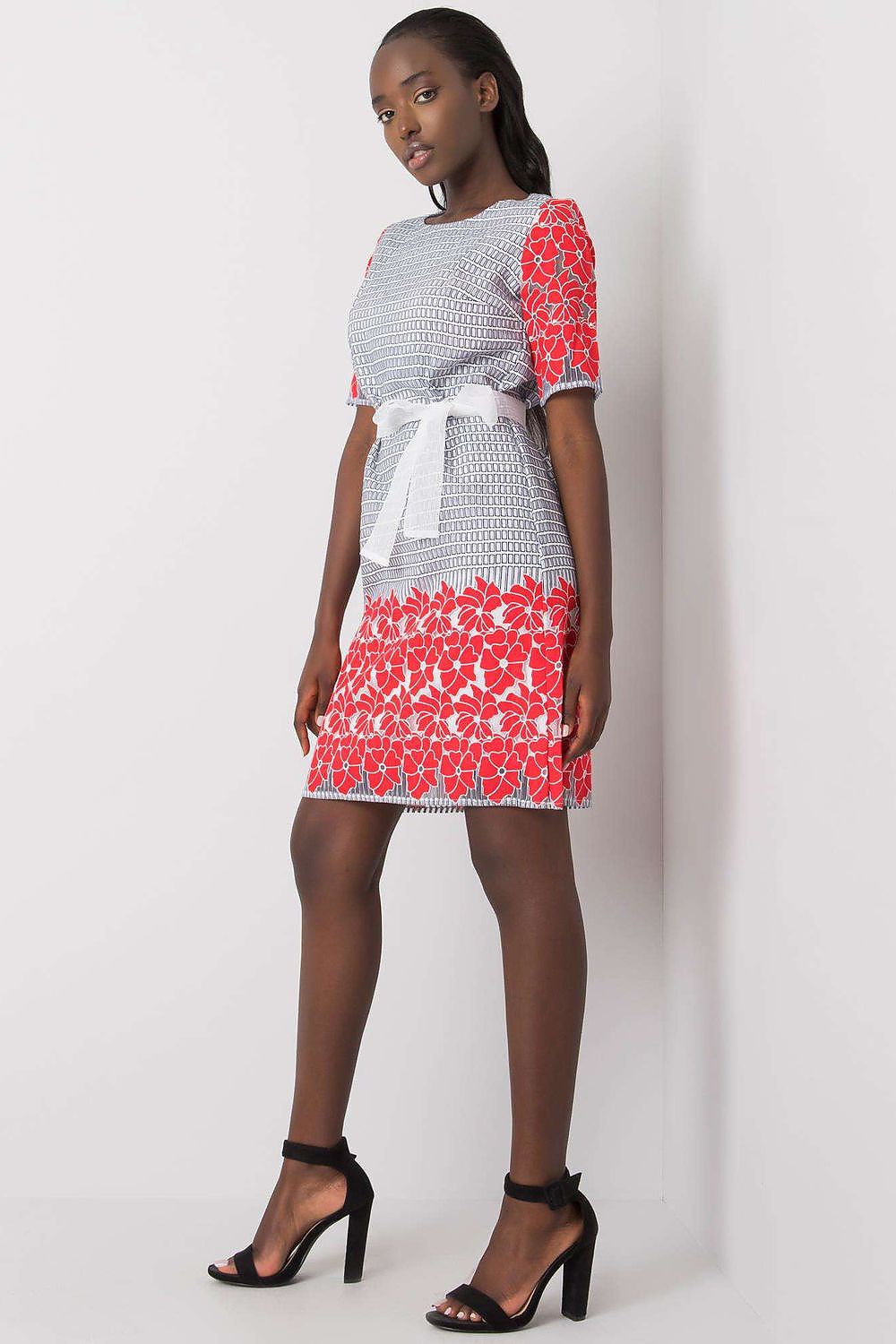 Back view of the Lakerta daydress highlighting the practical hidden zipper closure and elegant silhouette.