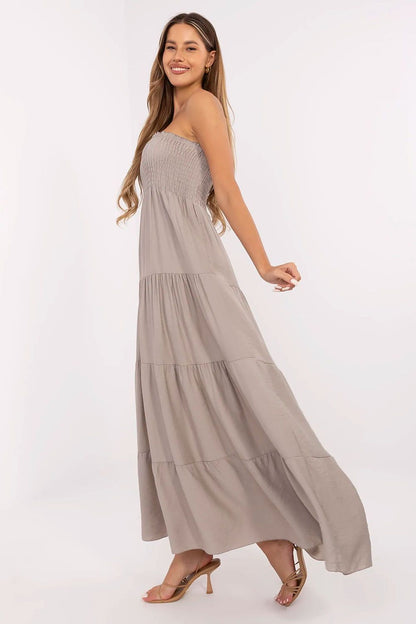 Elegant summer maxi dress with flared cut and ruffle hem by Italy Moda, showcasing a feminine silhouette and breathable viscose-linen blend fabric.