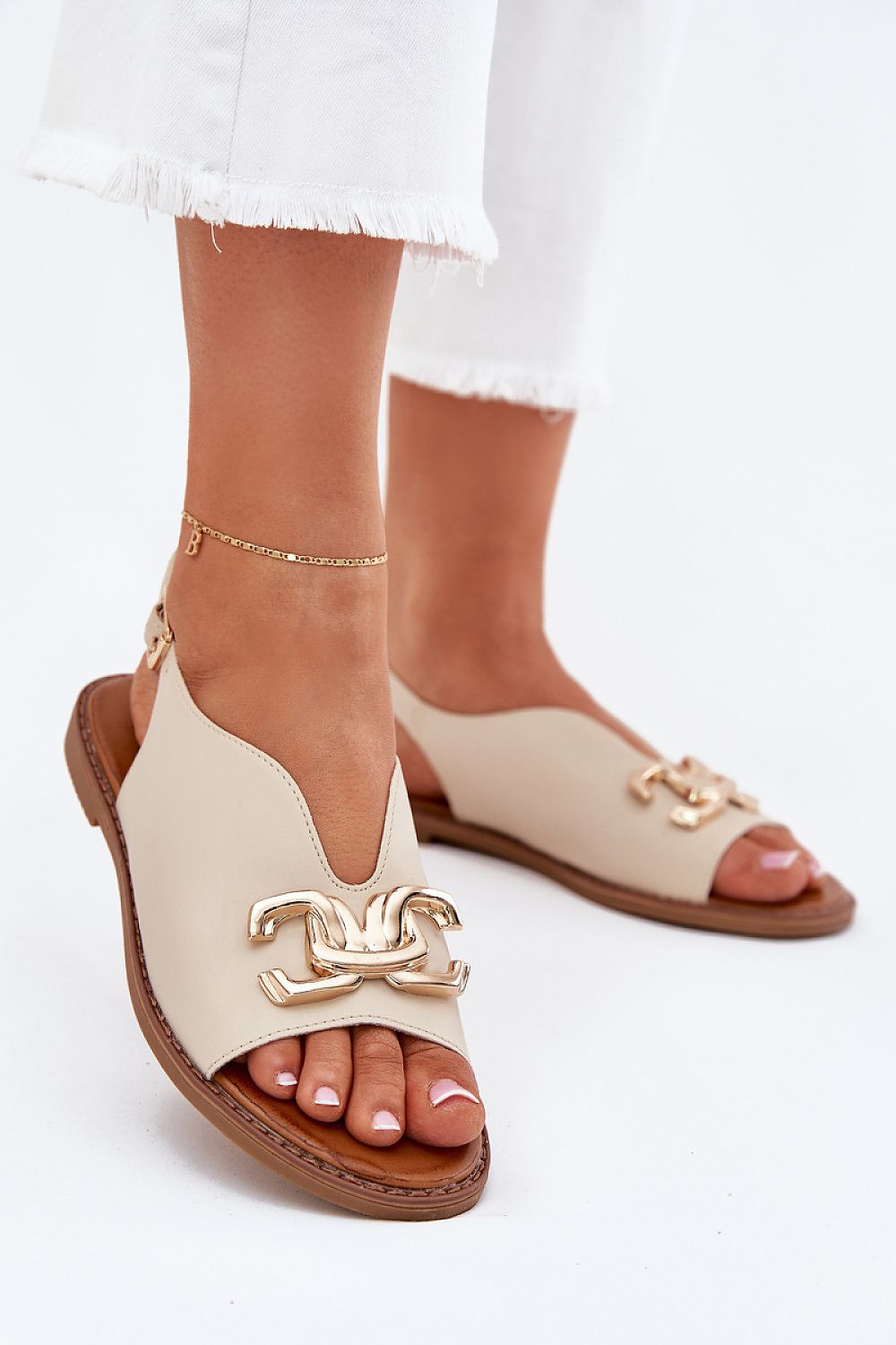 Step in Style eco-leather women's flat sandals with gold detailing, designed for comfort and elegance, available in EU sizes 36-41.