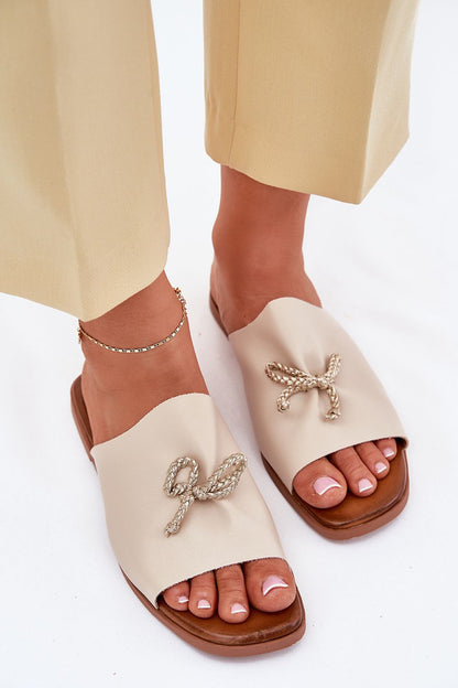 Elegant women's eco leather sandals with decorative lacing by Step in style, showcasing a chic flat heel design.