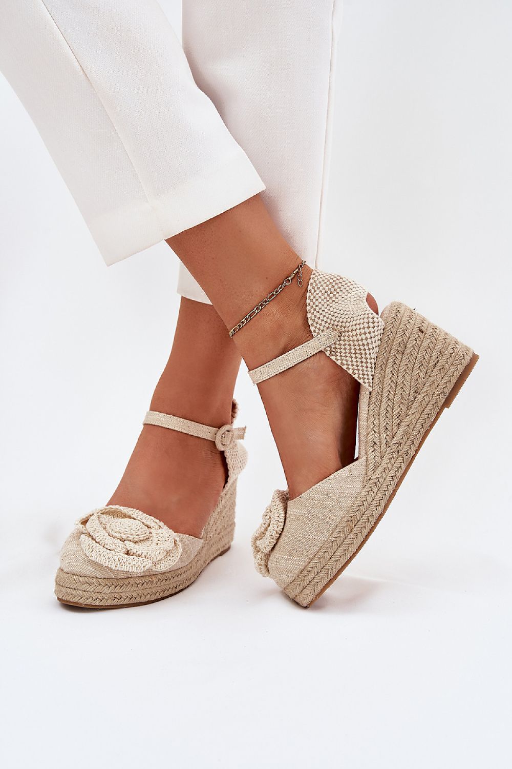 Elegant women's wedge sandals by Step in Style featuring a stylish braided design and a beautiful crocheted flower, perfect for summer fashion.
