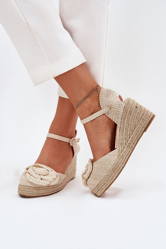 Elegant women's wedge sandals by Step in Style featuring a stylish braided design and a beautiful crocheted flower, perfect for summer fashion.