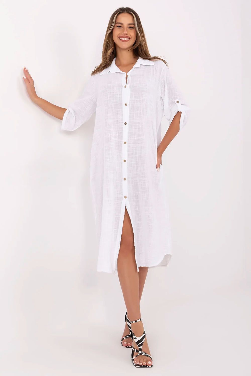 Stylish Och Bella midi-length shirt dress showcasing a loose fit, button fastening, and practical side seam pockets for casual elegance.