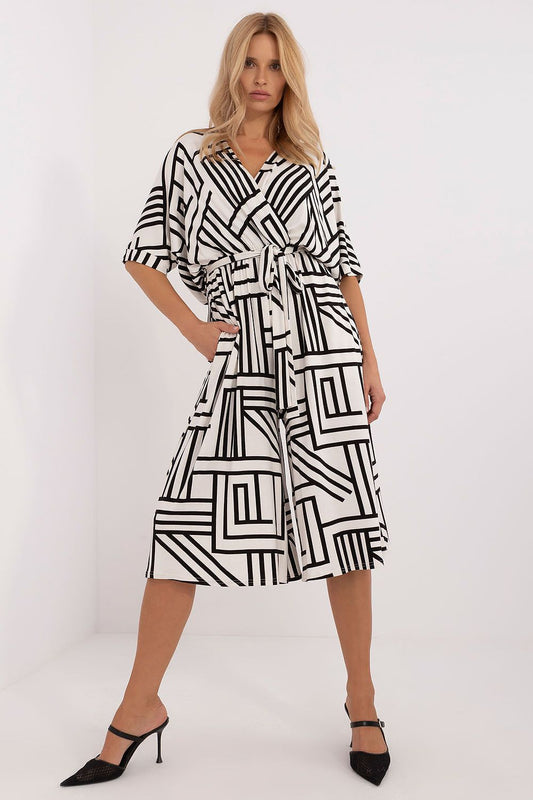 Elegant geometric pattern jumpsuit with waist belt and side pockets by Lakerta, showcasing a stylish design perfect for casual and formal occasions.