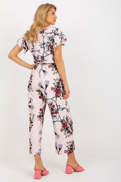 Stylish long trousers floral jumpsuit with a classic round neckline and cute ruffles, designed by Lakerta for a luxurious summer look.