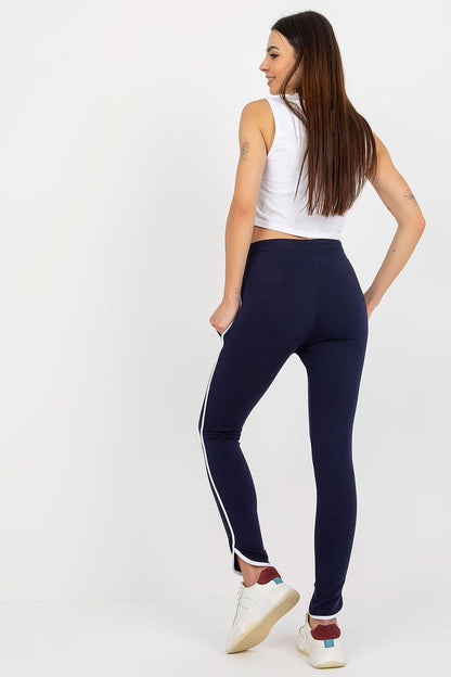 Fashionable high-waisted tracksuit trousers with functional side pockets, crafted in a soft cotton blend by Rue Paris.