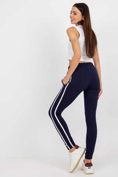 Elegant Rue Paris high-waisted tracksuit pants, made from a soft cotton-polyester blend, showcasing a flattering fit and stylish contrasting side stripes.