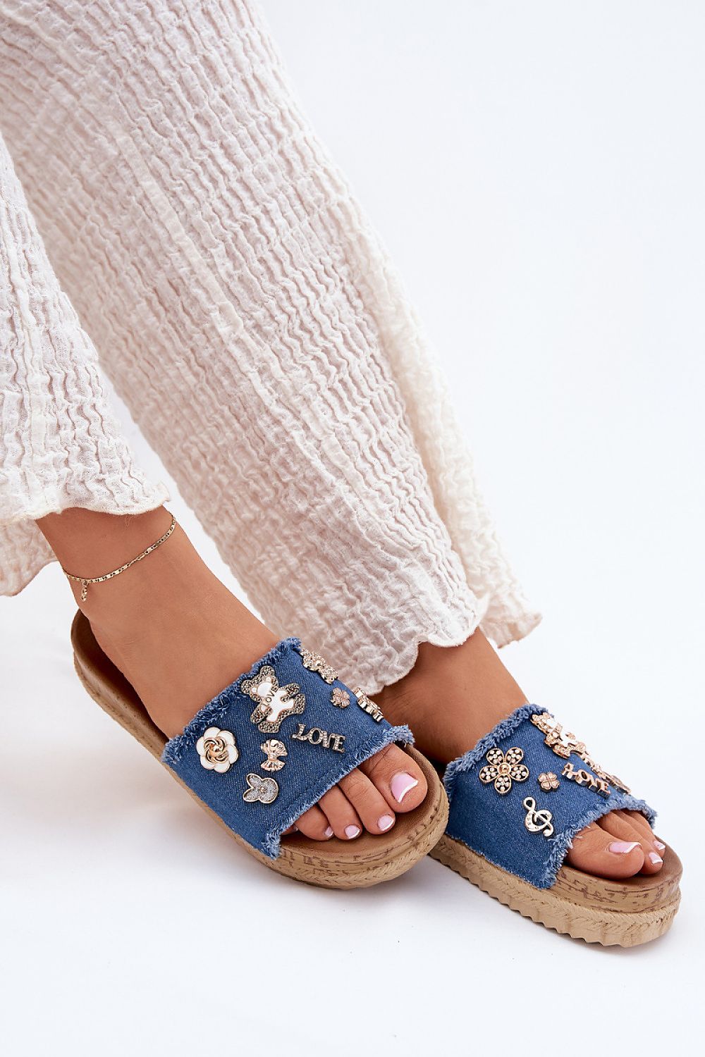Chic close-up of Step in Style women's platform sandals highlighting the luxurious textile strap and gold accents.