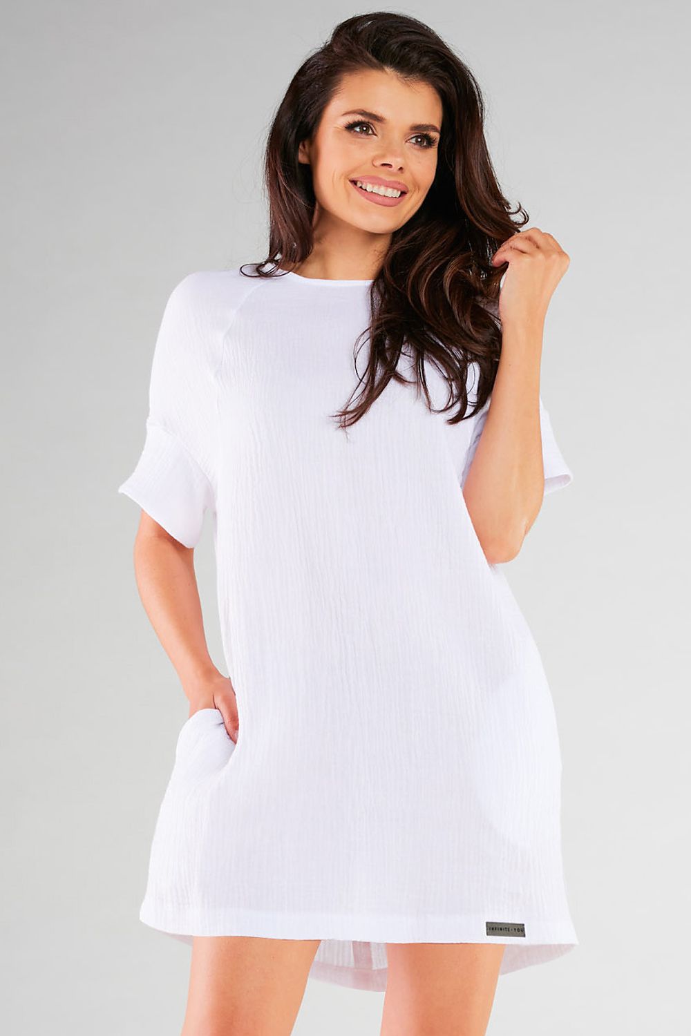 Chic Infinite You loose mini dress featuring a relaxed style, perfect for effortless elegance, made from soft knitwear in Poland.