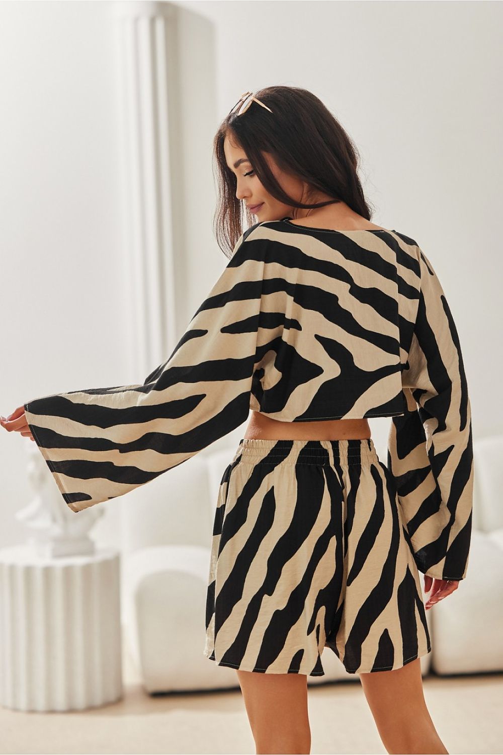 Sophisticated ensemble featuring Ilaria Animal Print Shorts for Women by Roco Fashion, designed for comfort and style in warm weather.