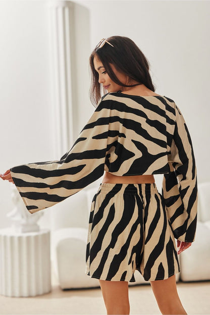 Sophisticated ensemble featuring Ilaria Animal Print Shorts for Women by Roco Fashion, designed for comfort and style in warm weather.