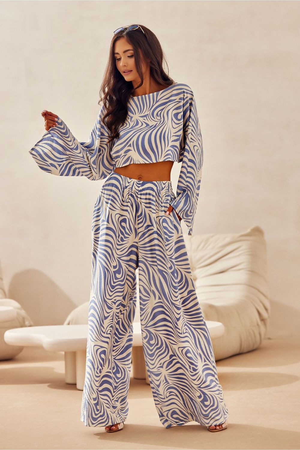 Elegant wide-leg trousers by Roco Fashion, featuring a bold animal print and tailored fit, perfect for summer styling.