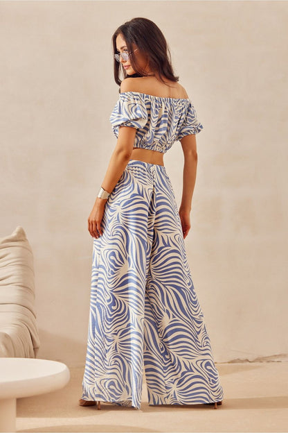 Chic animal print wide-leg pants from Roco Fashion, crafted for breathability and style, ideal for both casual and elegant outfits.