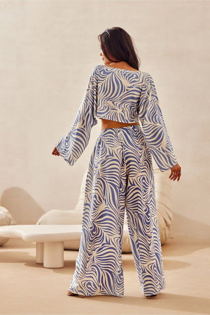 Luxurious Roco Fashion Women's Wide-Leg Trousers in bold animal print, showcasing the elegant and comfortable elastic waistband.