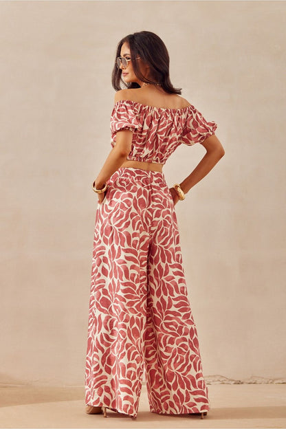 Chic and breathable women’s trousers from Roco Fashion, showcasing a vibrant animal print and a relaxed fit, ideal for fashionable summer outings.