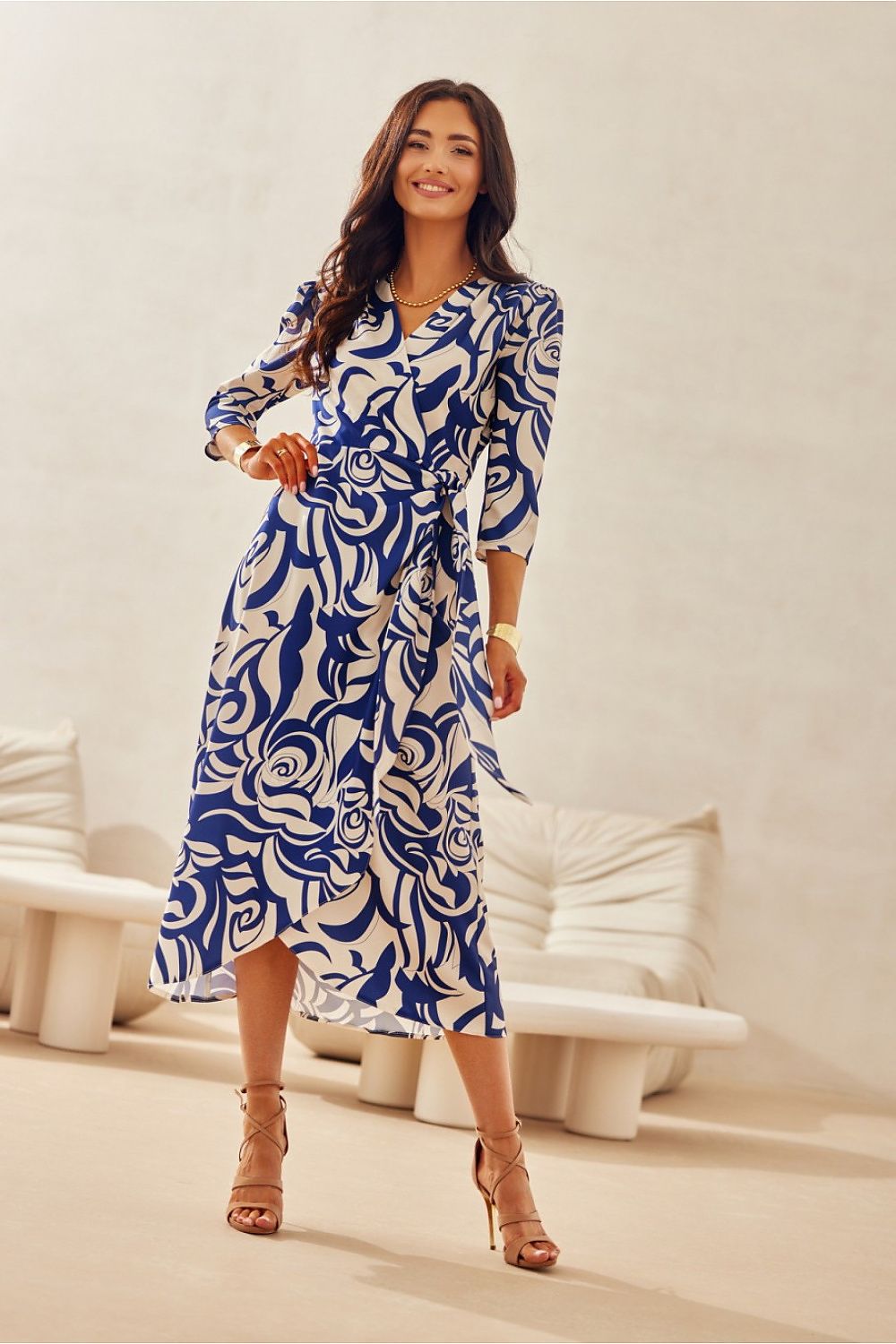 Model featuring the Mirella Midi Dress by Roco Fashion in a chic outdoor setting, exemplifying luxury and elegance.
