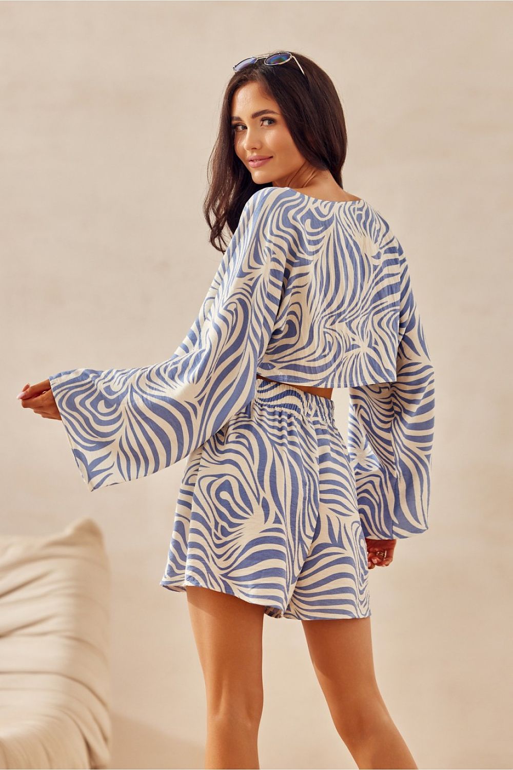 Stylish Bianca Roco Fashion blouse showcasing a lightweight, loose fit design ideal for summer, crafted from a delicate blend of viscose and linen, perfect for elegant summer outfits.